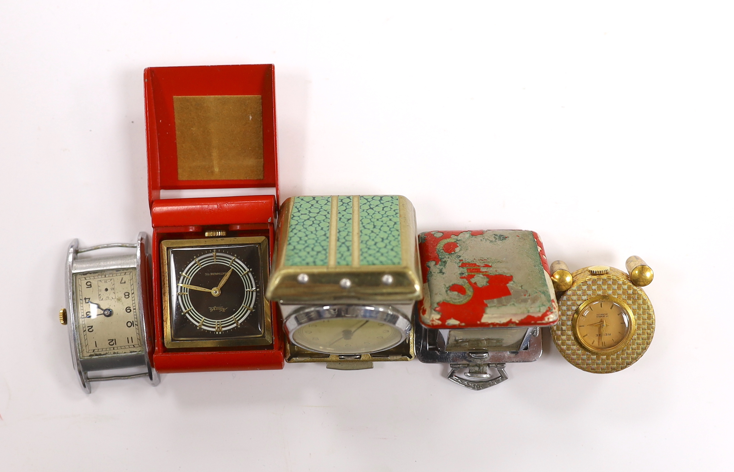 Four miniature travelling timepieces and a wrist watch